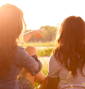 Woman with her daughter enjoying the sun