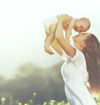 Mother Lifting Baby Up