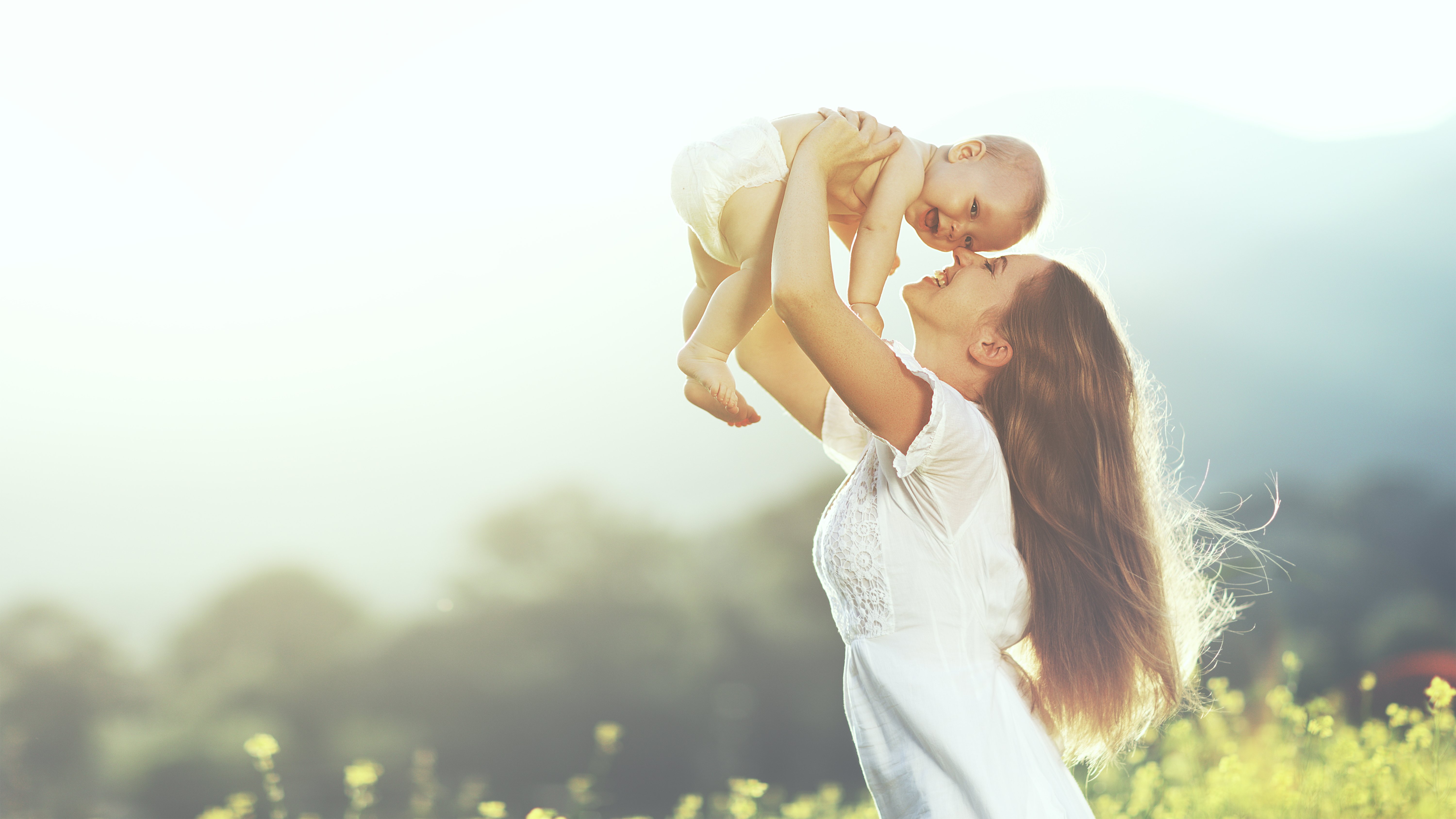 Mother Lifting Baby Up